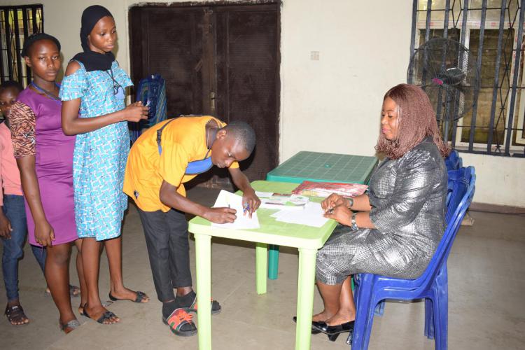 Youth signing up to attend an enlightenment program in Uyo